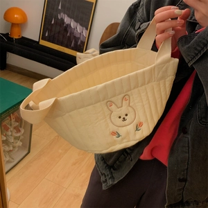 Quilted cream tote bag with fine rabbit and tulip embroidery on soft cotton fabric