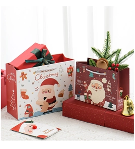 Detailed view of Christmas gift bags featuring Santa Claus and Merry Christmas text