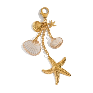 Detailed view of ocean-themed gold starfish and seashell charms for keychains