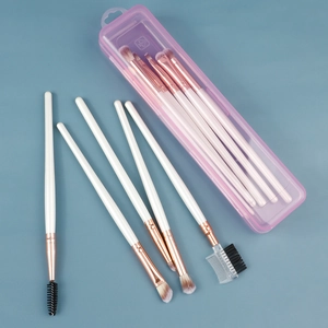 Pink transparent plastic storage box with white wooden handle makeup brush set inside