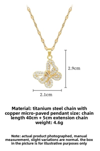 Detail of hollow butterfly pendant in gold titanium steel with micro-pave crystals