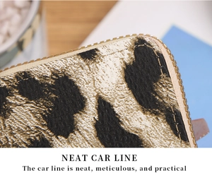 Close-up of leopard print card wallet showing neat stitching and gold metal zipper detail