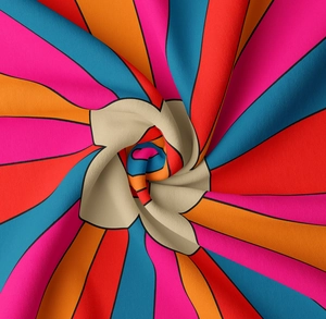 Macro shot of colorful bohemian tapestry fabric with a vibrant spiral pattern and texture