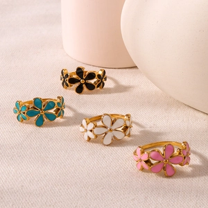 Colorful enamel flower stainless steel rings set in black, blue, white and pink
