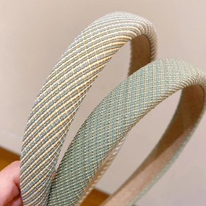 Striped pastoral style headbands with blue, brown and light green woven fabric textures