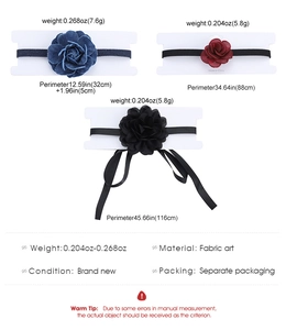 Detail view of fabric rose chokers in blue denim, burgundy, and black with size specs