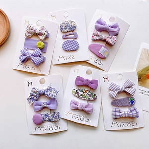 Handmade purple floral hair clip set for girls with bows and checkered patterns