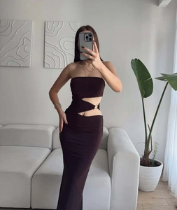 Detail of dark brown bodycon dress featuring side cut-out and metal ring accent