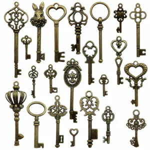 Macro detail of mixed vintage bronze key pendants with heart and crown motifs