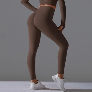 Detail of scrunch bum yoga leggings and long sleeve crop top in dark coffee brown