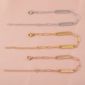 Detailed view of stainless steel paperclip chain bracelets in silver, gold, and rose gold