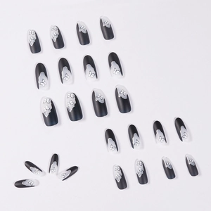 Dark gothic butterfly press-on nails with matte black and white gradient almond design