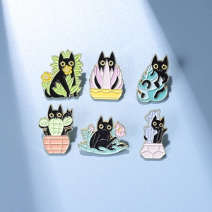 Detailed view of six cartoon black cat enamel pins featuring plants and floral designs