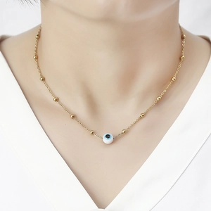 Elegant 18K gold-plated stainless steel Evil Eye necklace on a female model
