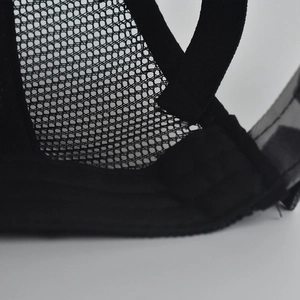 Detailed close-up of the breathable mesh back and adjustable strap on the black cotton cap