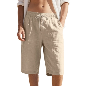 Detail of men's beige linen shorts featuring elastic drawstring waist and breathable fabric
