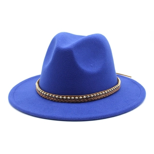 Detail of royal blue wool fedora with woven brown cord and gold metal chain band