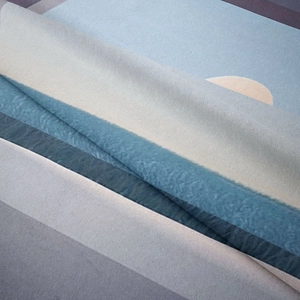 Close-up of soft bohemian tapestry fabric showing abstract patterns and texture