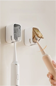 Wall-mounted toothbrush holder detail featuring an 80-degree flip cover for dust protection