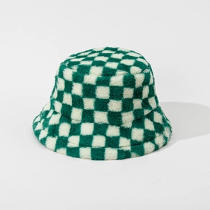 Close-up detail of green and white checkerboard plush bucket hat with soft fur texture