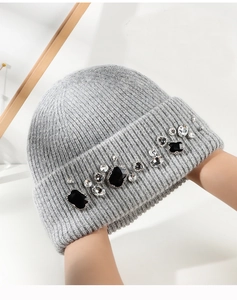 Gray knitted rabbit fur hat with luxury crystal embellishments for winter warmth