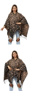 Detail shot of leopard print knit poncho featuring fringe hem and soft brown fabric