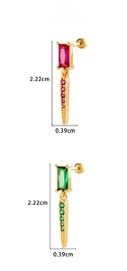 Detail of vintage geometric earrings with red and green stones and screw back closure