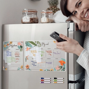 Close-up of magnetic acrylic daily and weekly planner with floral design and markers