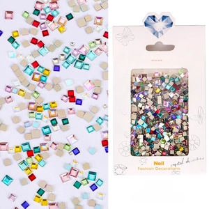 Macro shot of colorful square crystal rhinestones for nail art in professional packaging