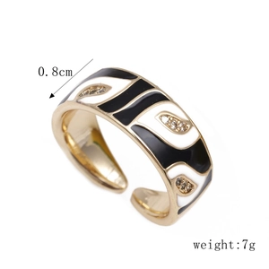 Detail shot of golden enamel evil eye ring showing 0.8cm width and 7g weight measurement
