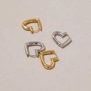 Minimalist hollow heart hoop earrings in polished gold and silver finishes