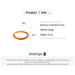 Detail showing 8cm diameter and 12.7g weight of orange amber acrylic round bangle