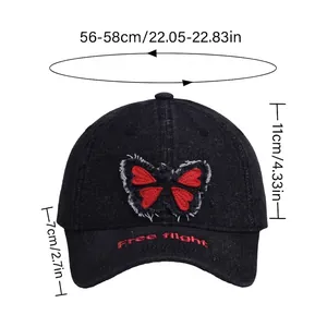 Denim baseball cap with butterfly embroidery and Free Flight text including size chart