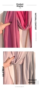 Detail view of pink and lilac plaid imitation cashmere scarf with soft twill texture