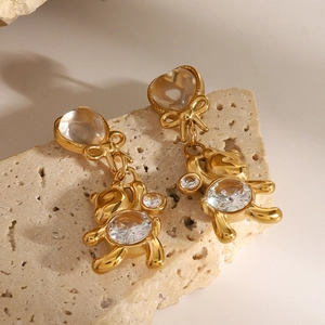 Boucles d'oreilles ours en acier doré avec nœud papillon et zircon sur socle pierre