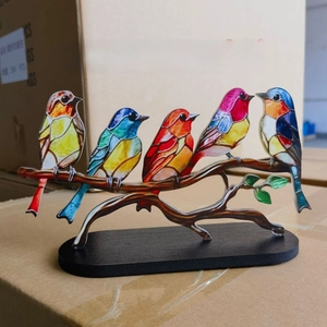 Artistic colorful acrylic birds on branch with solid black wooden base home decor detail