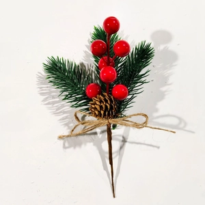 Detail of Christmas berry pick with pine cones, needles and rustic jute rope bow