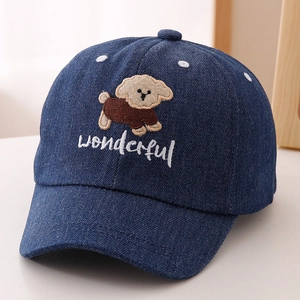 Close-up of cute cartoon puppy embroidery and denim texture on kids baseball cap