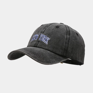 Close-up of vintage washed grey baseball cap with blue and white New York embroidery