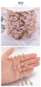 Detail of pink flower beaded chain with gold link and crystal accents for DIY jewelry