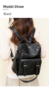 Detail of vintage black soft leather backpack for women with textured finish and tassel design
