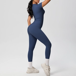 Detail of navy blue high-stretch compression yoga set with short sleeve top and leggings