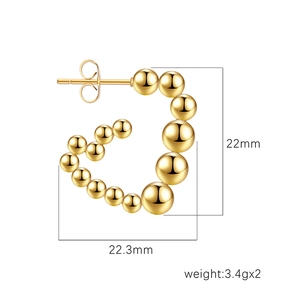 Polished 18K gold triangular heart earrings with graduated beads measuring 22mm