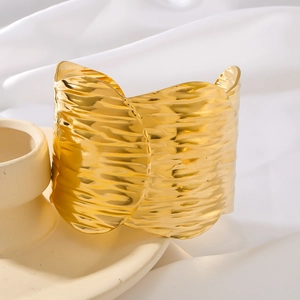 Polished 18k gold plated stainless steel open bangle with unique crumpled metal texture