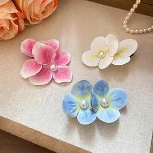 Three-piece floral hair clips set with pearls in pink, white, and blue summer styles