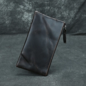 Detailed view of the dark brown crazy horse leather wallet with premium zipper puller