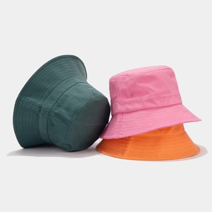 Detail view of cotton bucket hats with reinforced stitching and breathable side eyelets