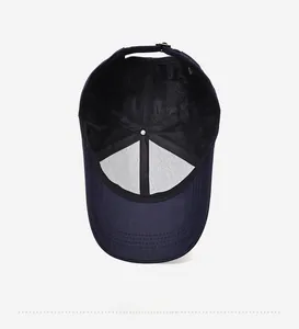 Detail view of navy baseball cap interior with breathable mesh lining and metal buckle