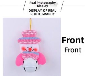 Detailed view of a pink snowman Christmas ornament with a white star-cut metal bell