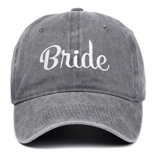 Detailed view of white Bride embroidery on dark grey vintage washed cotton baseball cap